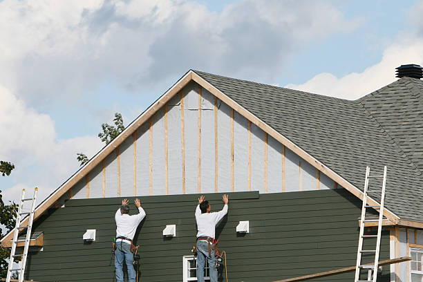 Professional Vinyl Siding technician working in Westville, IN